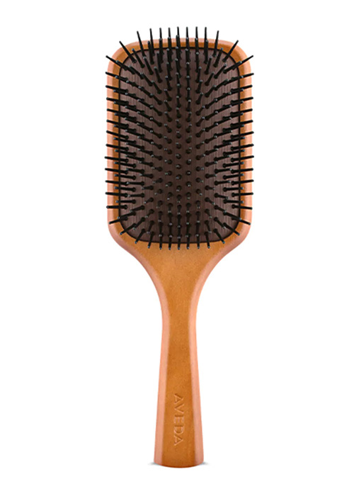 A polished wooden hairbrush packed with fiery sting