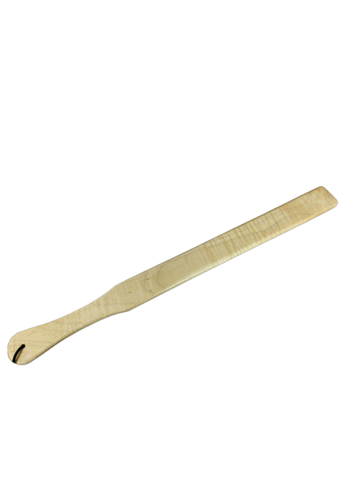 A long pale wooden ruler capable of imparting reminders to measure your manners