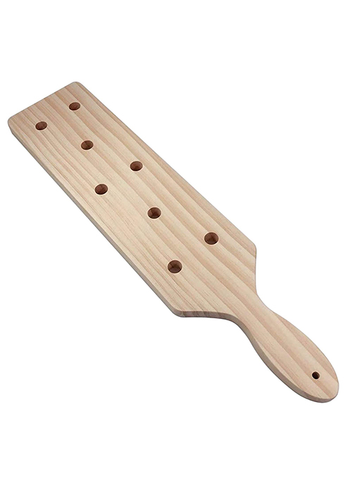A pale wood punishment paddle with 8 holes drilled in it promising a thunderous lesson
